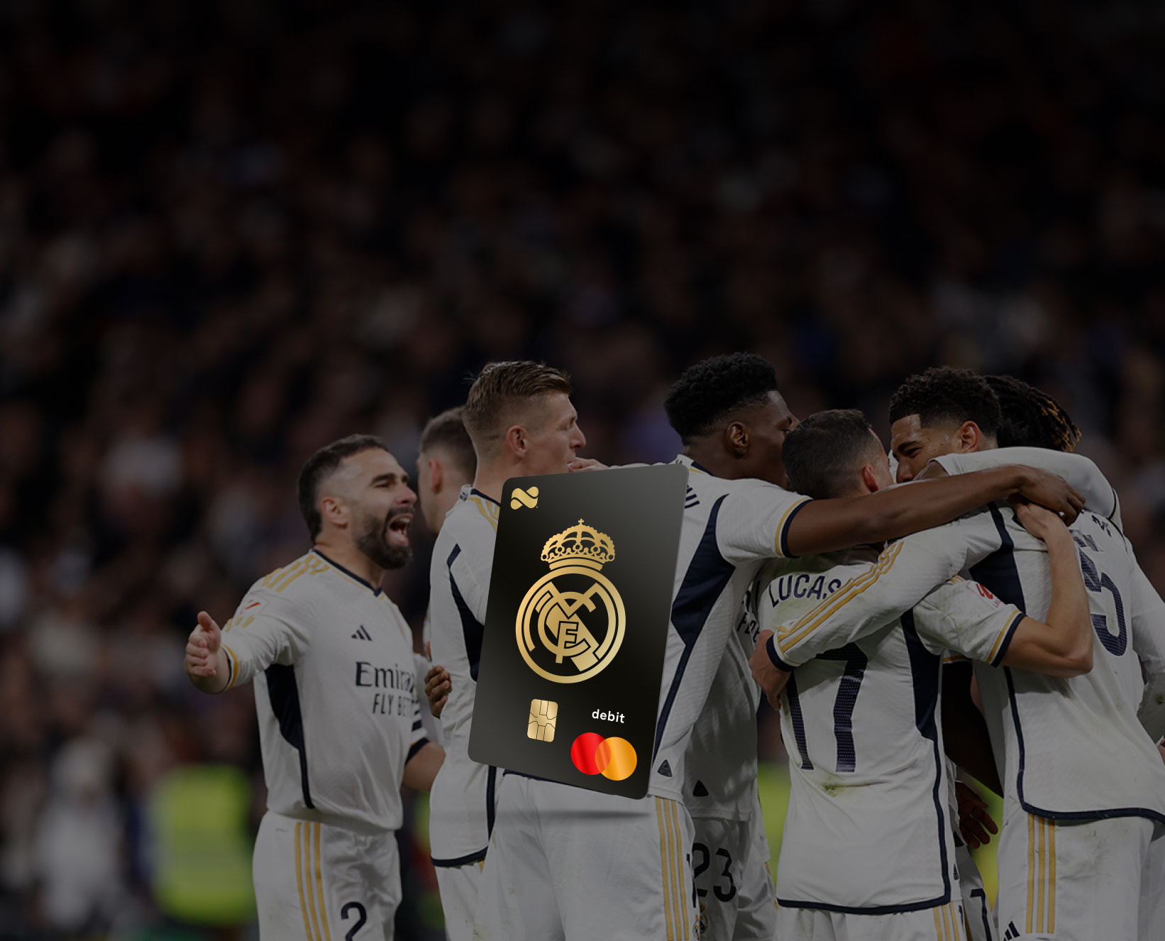 Netspend Real Madrid Mastercard overlayed in front of Real Madrid players huddled